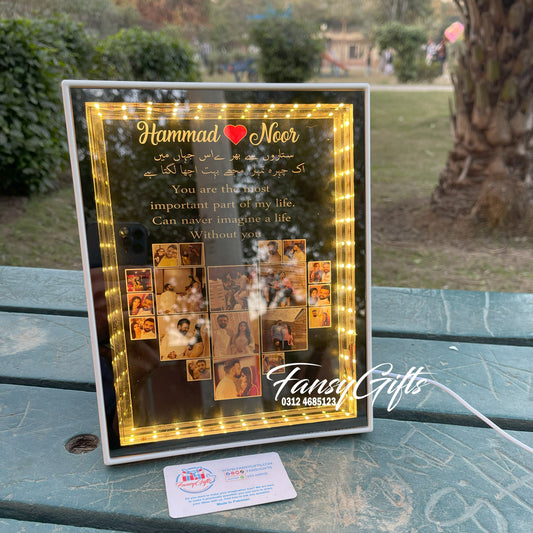 Decorative framed collage with text and images on a table outdoors